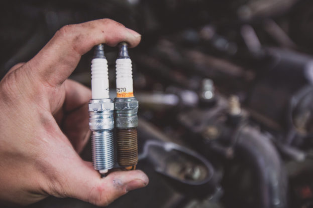 Photo of a new and old spark plug during a spark plug change by mobilemechanicgardengrove.com